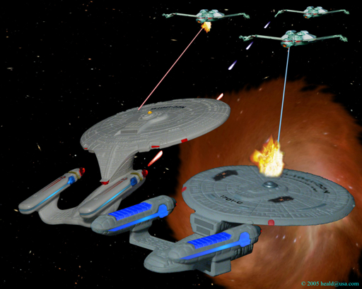 As the Enterprise C returns through the subspace rift, the D defends it from three Klingon K'Vort battle cruisers.  Enterprise C by Micro Machines, D and battle cruisers by Hallmark with modifications.  Click to see an Enlarged (512 by 410 pixels) view.