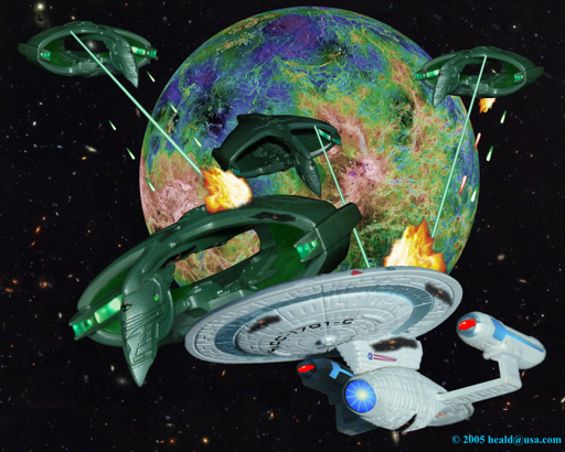 Back in its time, Enterprise C defends the Klingon outpost on Narendra III from four Romulan Warbirds.  The planet is the result of a radar survey of cloud-shrouded Venus with the colors depicting different elevations.  Enterprise C by Micro Machines, Warbirds by Hallmark.  Click to see an Enlarged (512 by 410 pixels) view.